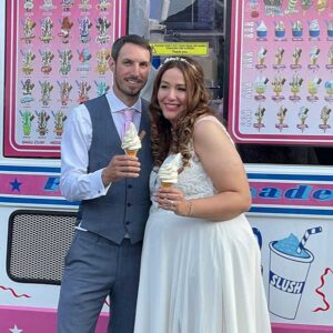 closeup of a newly married couple having ice cream